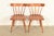 An exceptional pair of iconic Mid-Century Modern solid birch spindle back side chairs or dining chairs By Paul McCobb for...