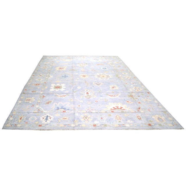 Hand-knotted with care using traditional rug-making techniques, this wool rug blends timeless craftsmanship with a modern...