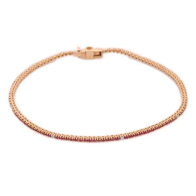 This is part of Chairish’s Fine Jewelry assortment. This Sleek Diamond and Ruby Bracelet in 18K gold showcases 112...