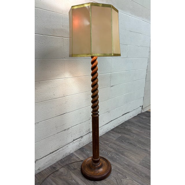 An exceptional turn-of-the-century antique American Jacobean Revival floor lamp crafted from solid quarter-sawn white oak,...