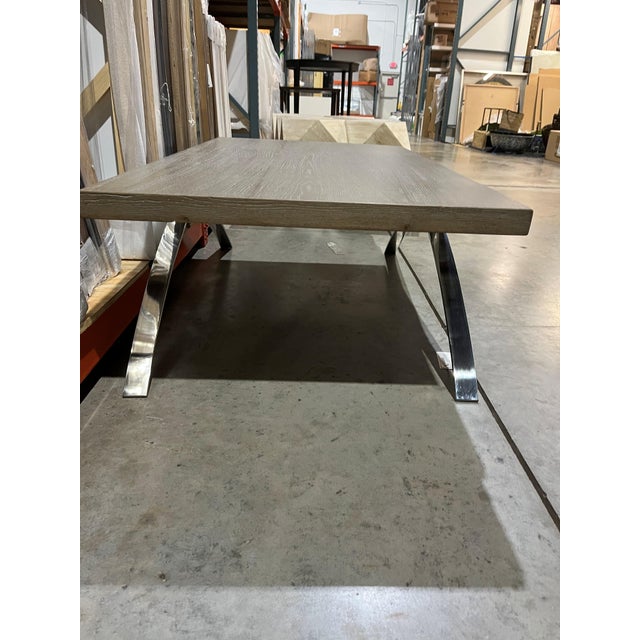 This sleek contemporary coffee table hits two big design marks with the greige oak and aluminum legs. The narrow footprint...