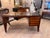 A beautifully crafted walnut and cherrywood writing desk with many interesting designs. Asymmetric reeded top with a heavy...