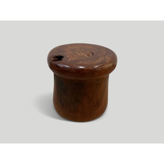 Antique mortar originally used to grind rice. We turned it upside down and smoothed out the entire piece revealing the...