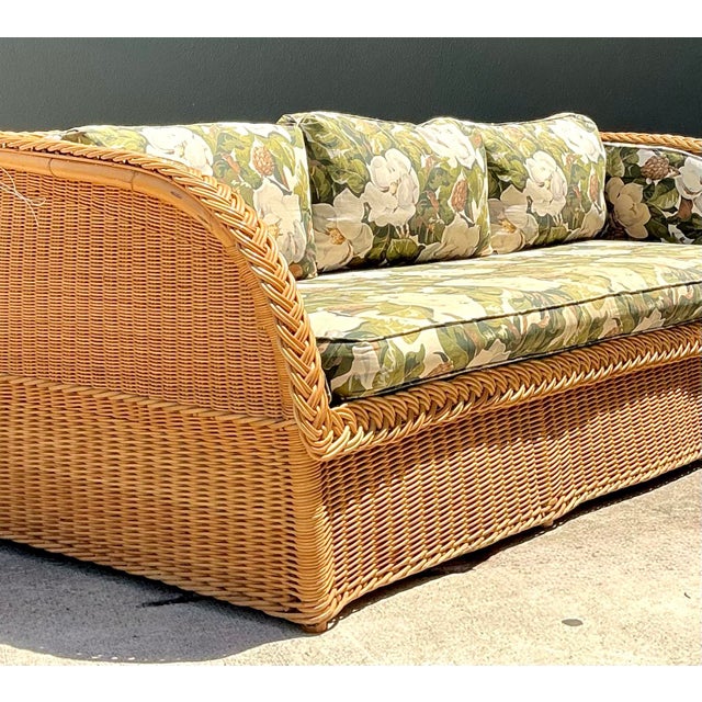 Hollywood Regency Vintage Braided Rattan Magnolia Print Sofa For Sale - Image 3 of 12