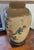 Vintage Oriental lamp. It is glass and I believe it may be reverse glass painting. The front of the lamp is full of...