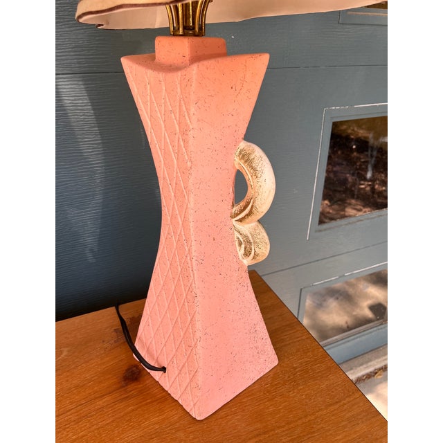 A delightfully glamorous pair of 1950s Hollywood Regency chalkware table lamps in the most coveted configuration —...