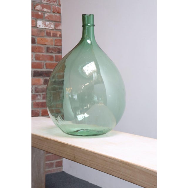 Italian Demijohn / Carboy originally used for transporting wine (ca. early 20th Century, Italy). Composed of attractive...
