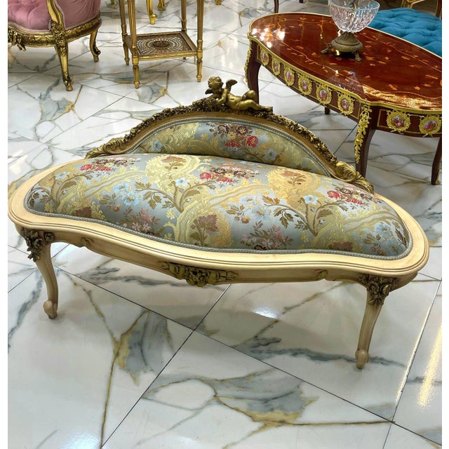 This exquisite antique French-style settee is a timeless statement piece, perfect for elegant interiors. Upholstered in...