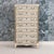 A charming French tall chest of drawers from the 18th century with fluted round corner posts. Beautiful patina with...