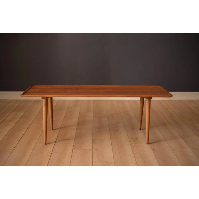 Mid-century modern original coffee table designed by Hans Wegner for Andreas Tuck model AT-11. This solid planked teak...