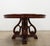 Beautiful round traditional dining table featuring a rich dark cherry mahogany-style finish, decorative veneer top with a...