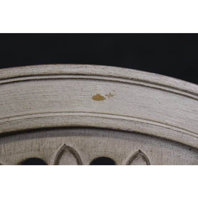 This is a bright, chic and gorgeous set of 8 chairs in the style of Maison Jansen. They are painted in an off-white and...