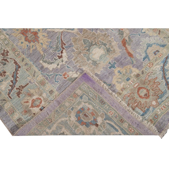 Beautiful Modern Sultanabad hand-knotted wool rug with a purple field. This Sultanabad rug has a blue frame and multi-...