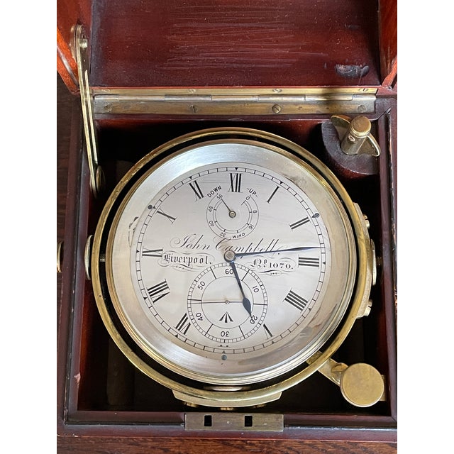 A good English brass 2-day (54 hour) Marine Chronometer in a 3-tier Brazilian Rosewood case, made by John Campbell,...