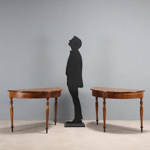 Pair of walnut console tables with a half-moon top, supported by three turned legs. Fir interiors. Italy, early 20th...