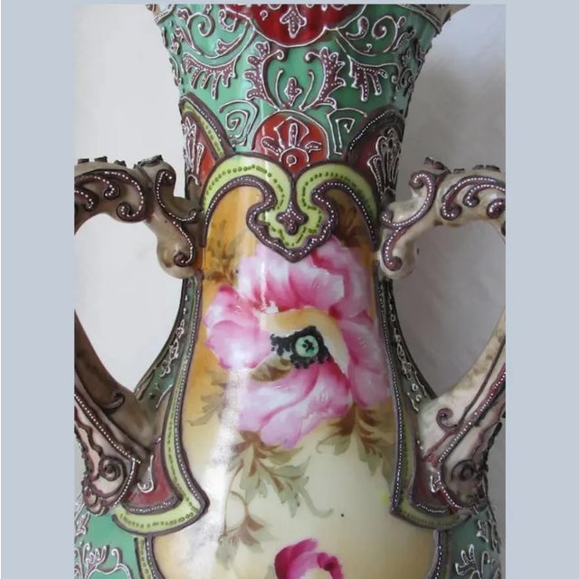 An Antique Asian, Japanese Moriage Vase. The Vase is hand painted with pretty Poppy Flowers and has a raised moriage...
