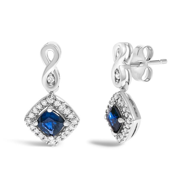 Imagine draping your ears with the celestial elegance of these dazzling dangle earrings, crafted in radiant 10K white...