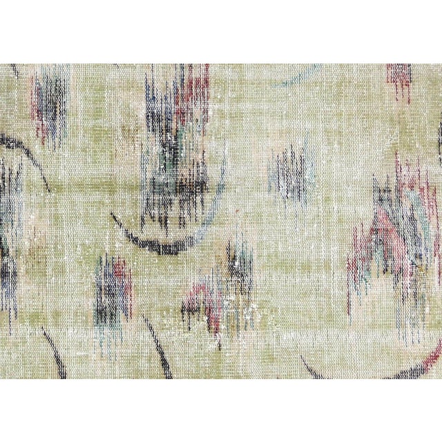 This vintage Turkish mid-century modern rug is meticulously handwoven with wool on a cotton foundation in the Sparta...