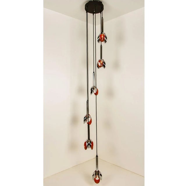 A special cascade with 6 chrome and orange pendants. The light is made in the style of raak, a dutch manufacturer of the...