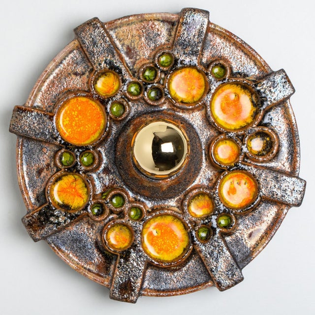 Orange brown ceramic wall lights in fat lava style. Manufactured by kaiser leuchten, germany in the 1970s. The style of...