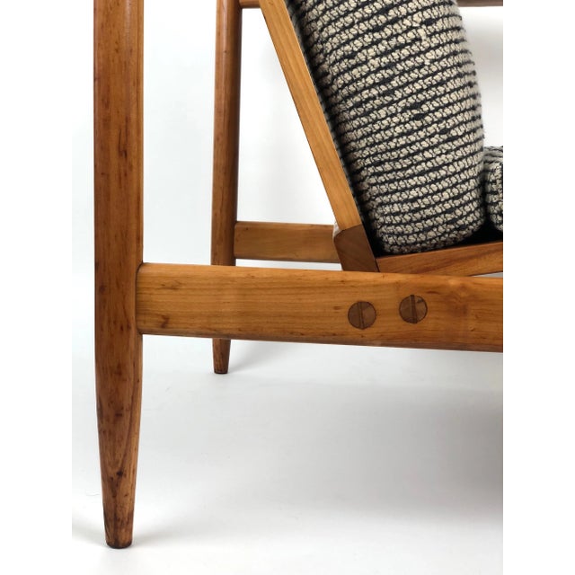A beautiful arm chair from Uluv in cherrywood. Handmade by one individual from start to finish. The upholstery is original...
