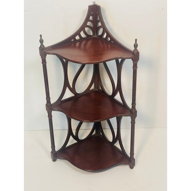 Super cute carved wood corner display etagere in 3 tiers.