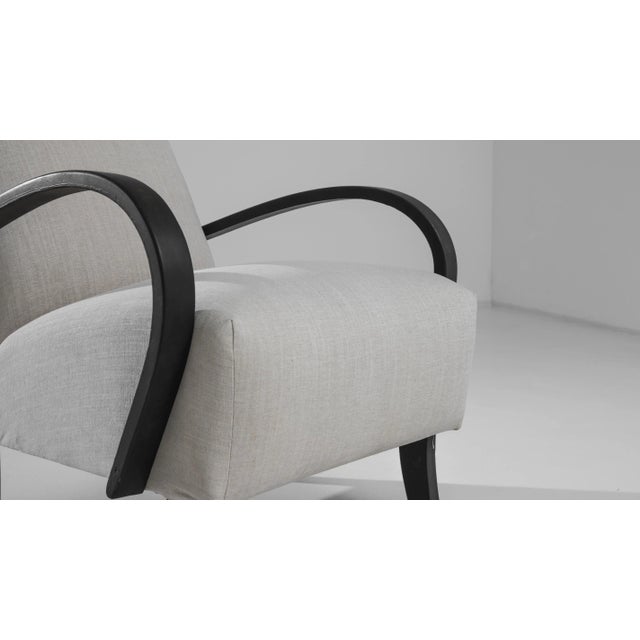 Made in the 1950s by renowned Czech furniture designer J. Halabala, this vintage wooden armchair combines irresistible...