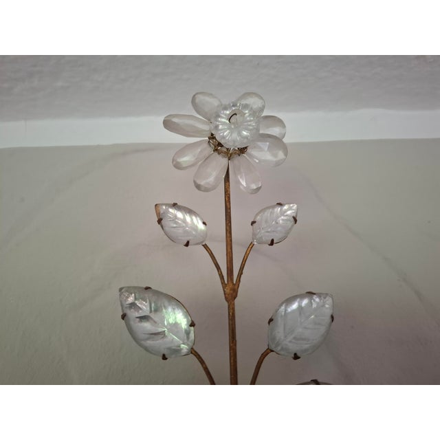 A beautiful wall light by Maison Baguès featuring the iconic floral and urn Design. Created in the 1920s. This Model is...