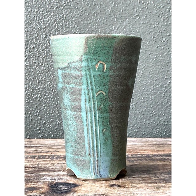 This vintage studio pottery green vase is a refined expression of mid-20th-century handcrafted ceramic design. Hand-thrown...