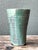 This vintage studio pottery green vase is a refined expression of mid-20th-century handcrafted ceramic design. Hand-thrown...