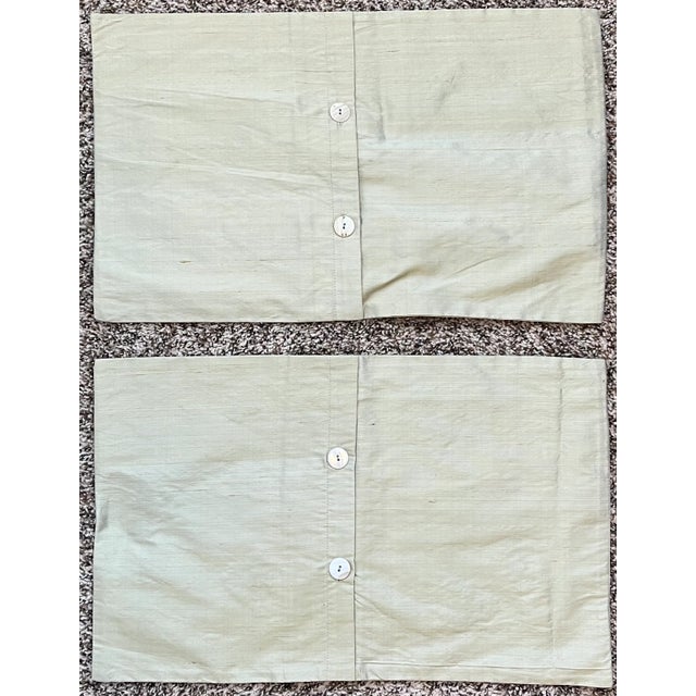 Beautiful pair of soft green silk pillow covers with embroidered butterflies sprinkled across the front. Add a touch of...