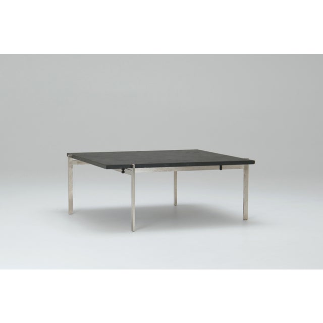 This is a poul kjærholm pk61 coffee table, designed for ejvind kold christensen, denmark, in 1956. It features a black...