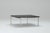 This is a poul kjærholm pk61 coffee table, designed for ejvind kold christensen, denmark, in 1956. It features a black...