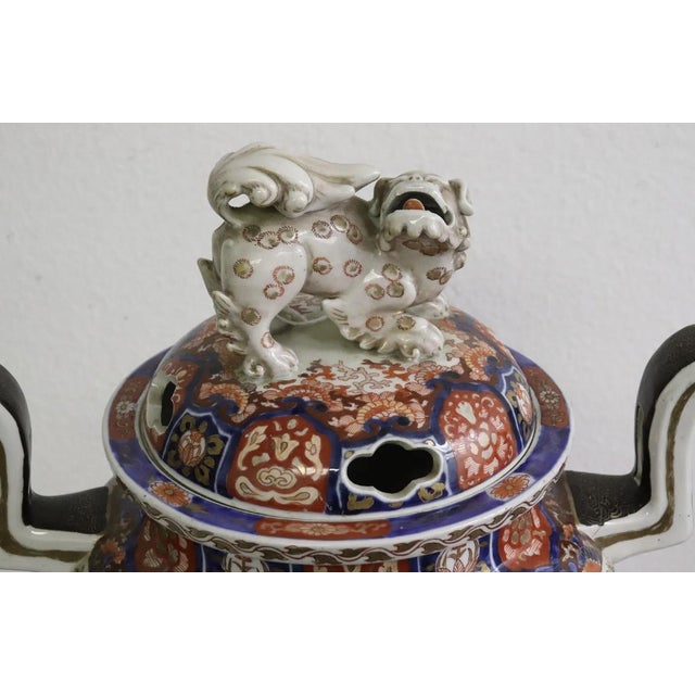 A fine quality 19th century Japanese lidded Imari Koro, in the classical bold blue and orange Imari colors, depicting...