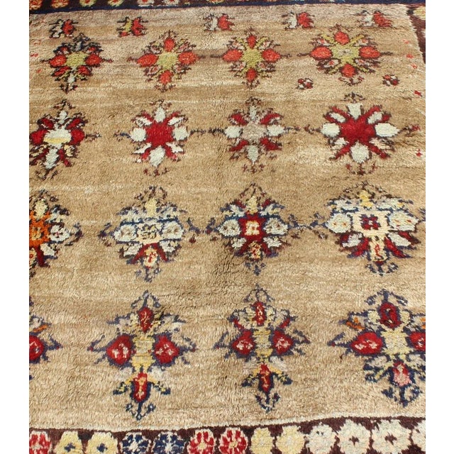 Tribal Early 20th Century Angora Turkish Tulu Carpet With Colorful Floral Designs Set on Sand Field For Sale - Image 3 of 12