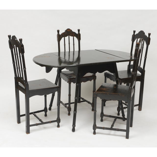 Japanese Tea Table with seating for four. Ebonized with gold highlighted carving of birds and mountains. Preserved patina...