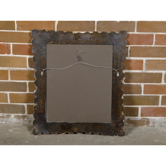 An Italian Midcentury giltwood mirror from circa 1950 with petal-themed frame. Step into the luxurious world of Italian...