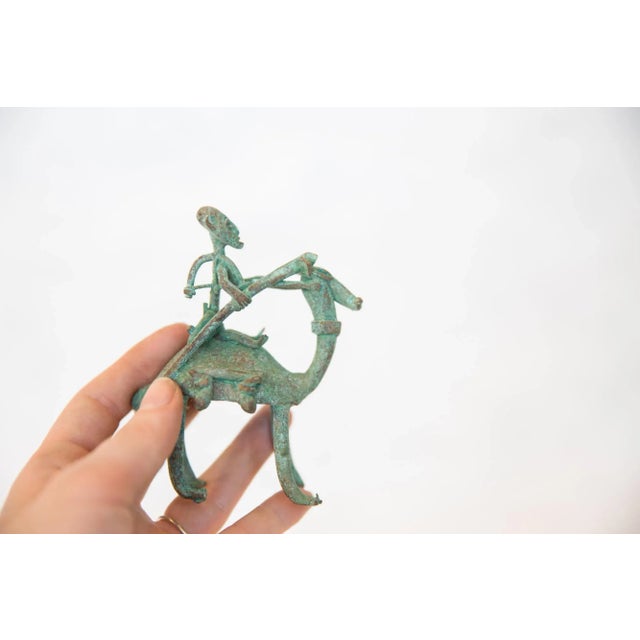 :: Vintage handmade oxidized copper person riding animal. Circa mid 20th century and possibly older, this piece has such...