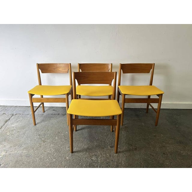 A very striking set of four mid-century dining chairs by edmund homa, produced by gościcińska fabryka mebli (gfm) in...