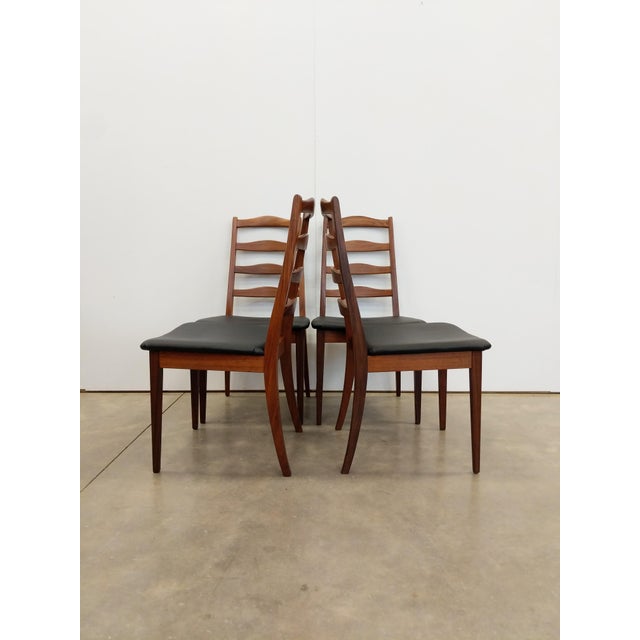 Set of 4 authentic vintage mid century modern dining chairs. Maker's label on bottoms. This set is in excellent condition...