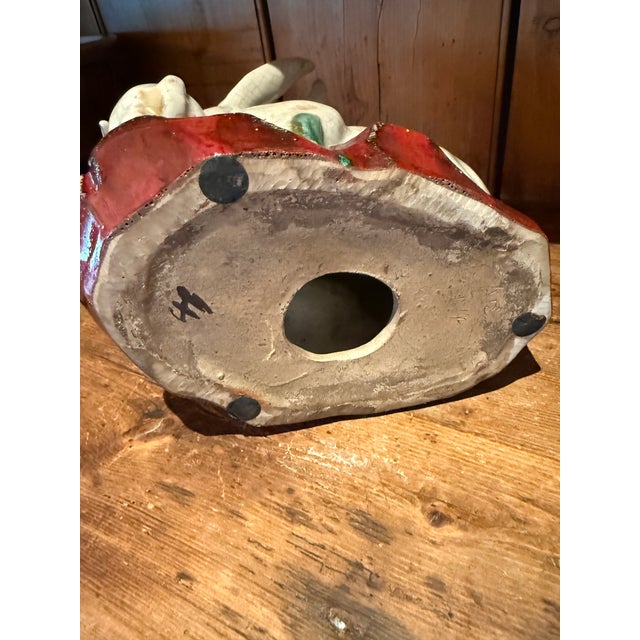 This is a sweet rabbit family full of fun and mischief. Ceramic majolica crackle glaze. Deep red base with greenery. 10”...