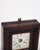 Decorative American clock from the 19th century, made of dark wood. The clock has a classic dial with Roman numerals and a...