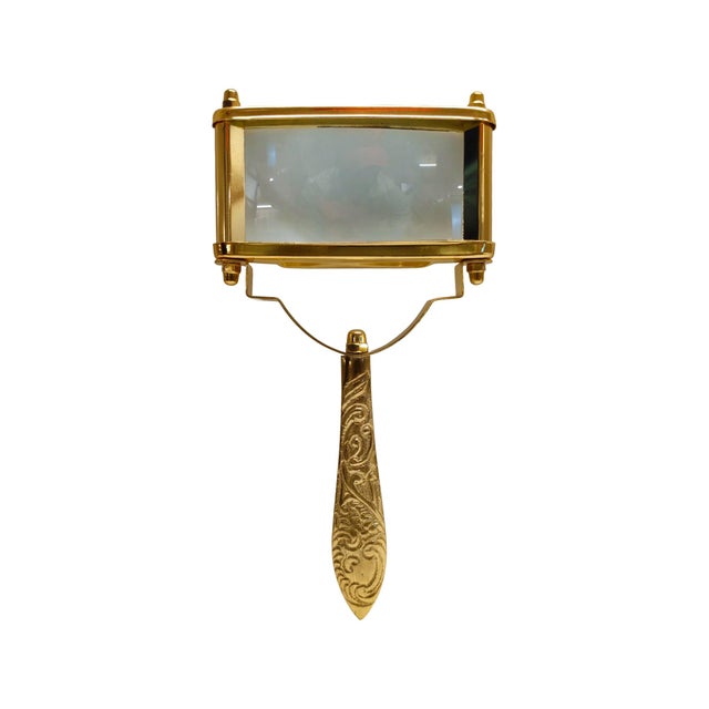 The smooth, elongated handle adds a touch of classic luxury, while the polished metal detailing enhances its elevated...