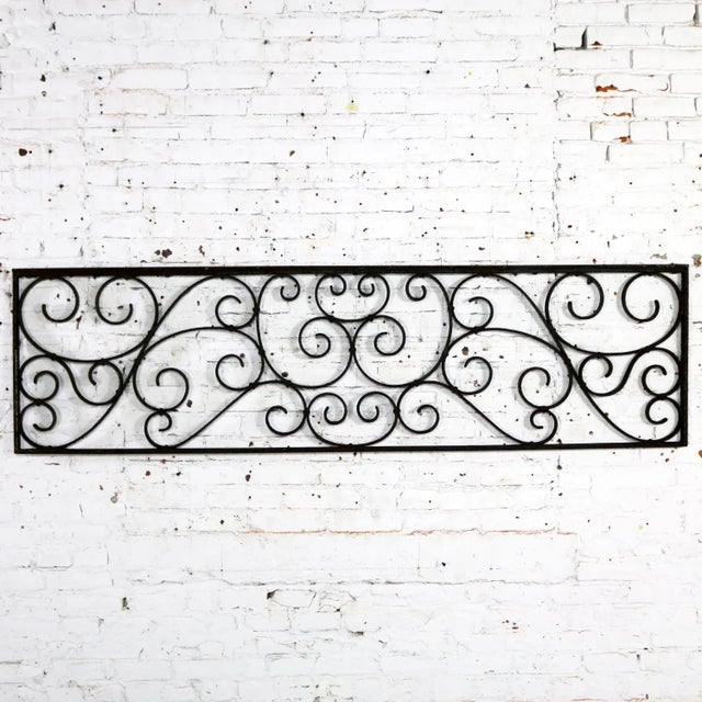 Gorgeous antique swirled design piece of wrought iron. It is, and was originally, a railing piece but could be used as a...
