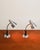 Adjustable aluminum diffusers, flexible brass neck, black-painted metal conical support, and satin-finish aluminum bases....