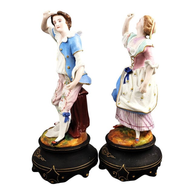 This pair of french porcelain figures was made in paris around 1860 by the letu & mauger manufactory. Depicting a gallant...