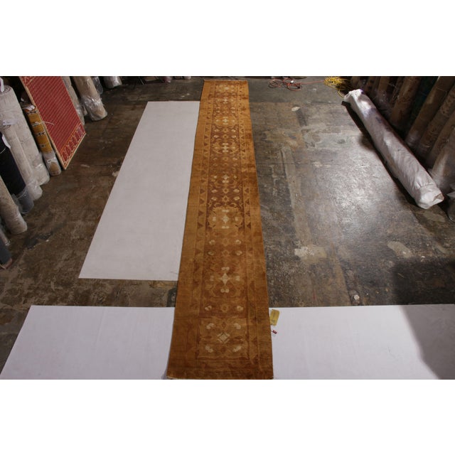 Hand knotted in wool from India circa 1890-1900, this 19th-Century antique runners originates as a fragment/border of a...