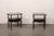 A French pair of black two-tiered end tables, with single drawer, from the mid 20th century. These mid-century end tables...
