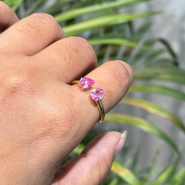 This Toi et Moi ring showcases 1.16 carats of pink sapphires, set in 14k yellow gold. The pear-shaped stone measuring...