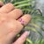 This Toi et Moi ring showcases 1.16 carats of pink sapphires, set in 14k yellow gold. The pear-shaped stone measuring...
